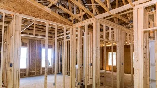 This image shows the interior framing of a house under construction.