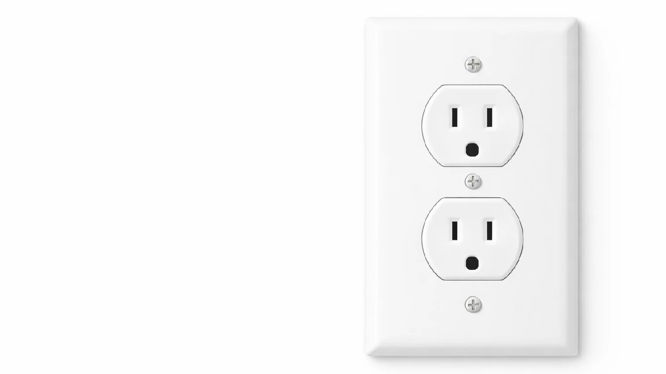 This is a standard 15 amp white duplex electrical outlet, often found in North American residential and commercial buildings.